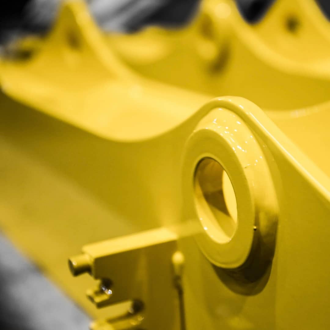 A close up of a yellow piece of equipment.